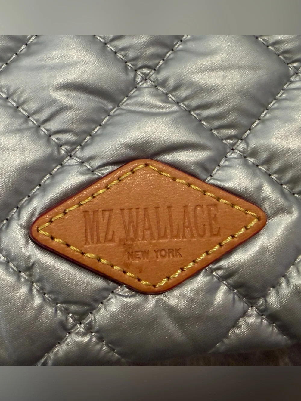 EUC MZ Wallace Metallic Silver Quilted Cosmetic Pouch with Yellow lining
